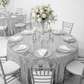 Large Payette Sequin Round 120" Tablecloth - Silver with Silver Chiavari Chairs.
