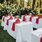 Outdoor Wedding Reception with Red Satin Napkins