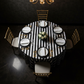 Stripe 120" Satin Round Tablecloth - Black & White in Luxurious Dining Reception with Gold Chiavari Chair in Birds Eye View.