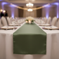 Low-angle view with willow green satin table runner