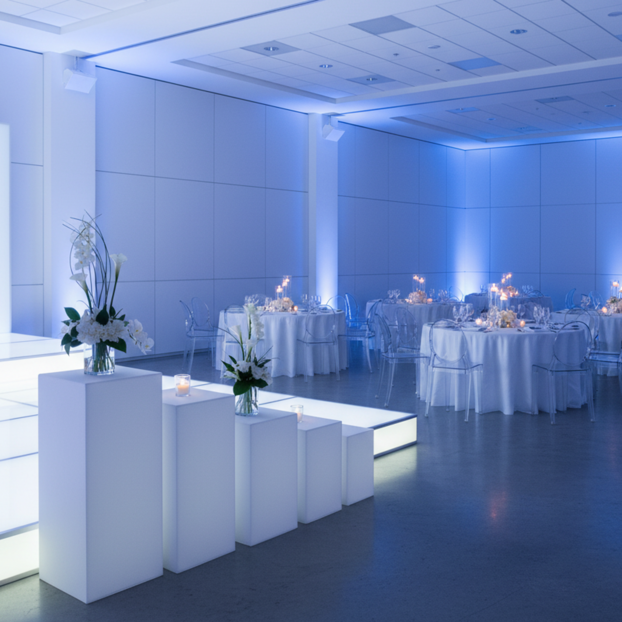 Modern corporate gala with white spandex square pedestal stands