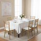 Economy Polyester Tablecloth 60"x120" Rectangular - White with Chiavari Gold Chairs.