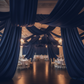 Navy Blue Satin Ceiling and Wall Drapes in Event Venue