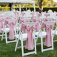Outdoor garden event with dusty rose pink chair sashes