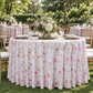 Outdoor garden reception scene with floral haze tablecloth