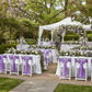 Outdoor garden reception with lilac chair sashes