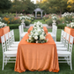 Outdoor garden wedding with orange velvet tablecloths