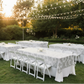 Outdoor garden wedding reception with silver lace table overlay