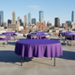 Outdoor rooftop event purple tablecloth