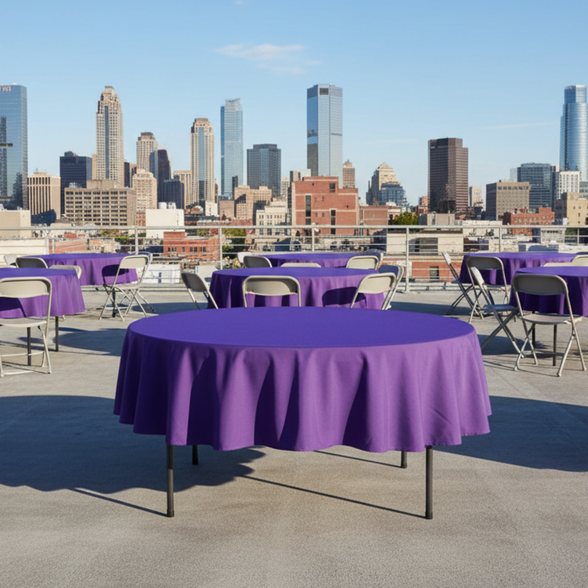 Outdoor rooftop event purple tablecloth