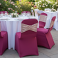 Outdoor wedding reception with blush rose gold spandex ruffled sequin chair band