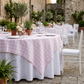 Pink gingham overlay at a courtyard reception
