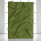 Pleated Crinkle Olive Green Fabric backdrop in bright lighting