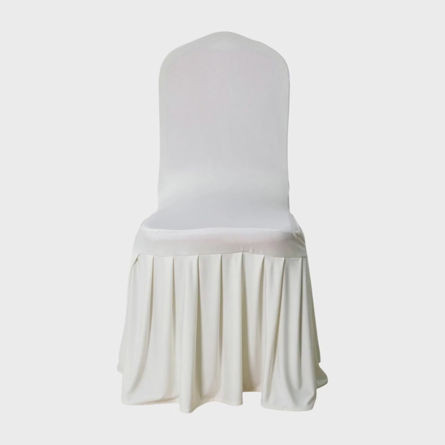 Ivory spandex banquet chair cover with a pleated, ruffled skirt, shown circling to reveal fitted back and flowing base.