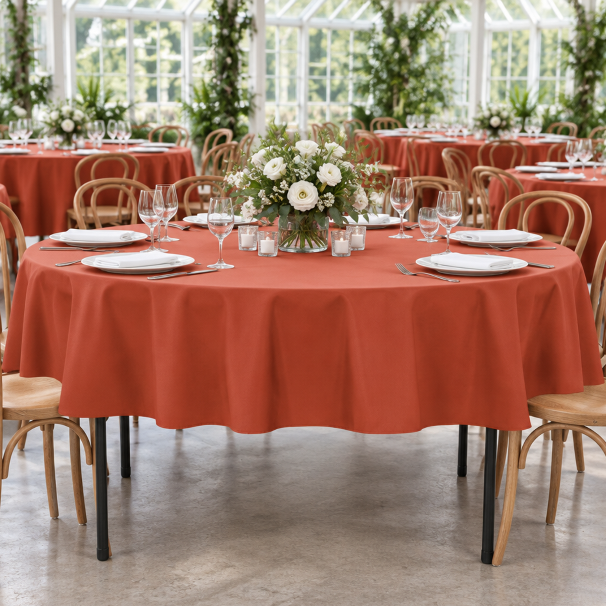 Rust tablecloth in a botanical conservatory wedding