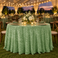 Sage green sequin velvet tablecloth at a covered tent event