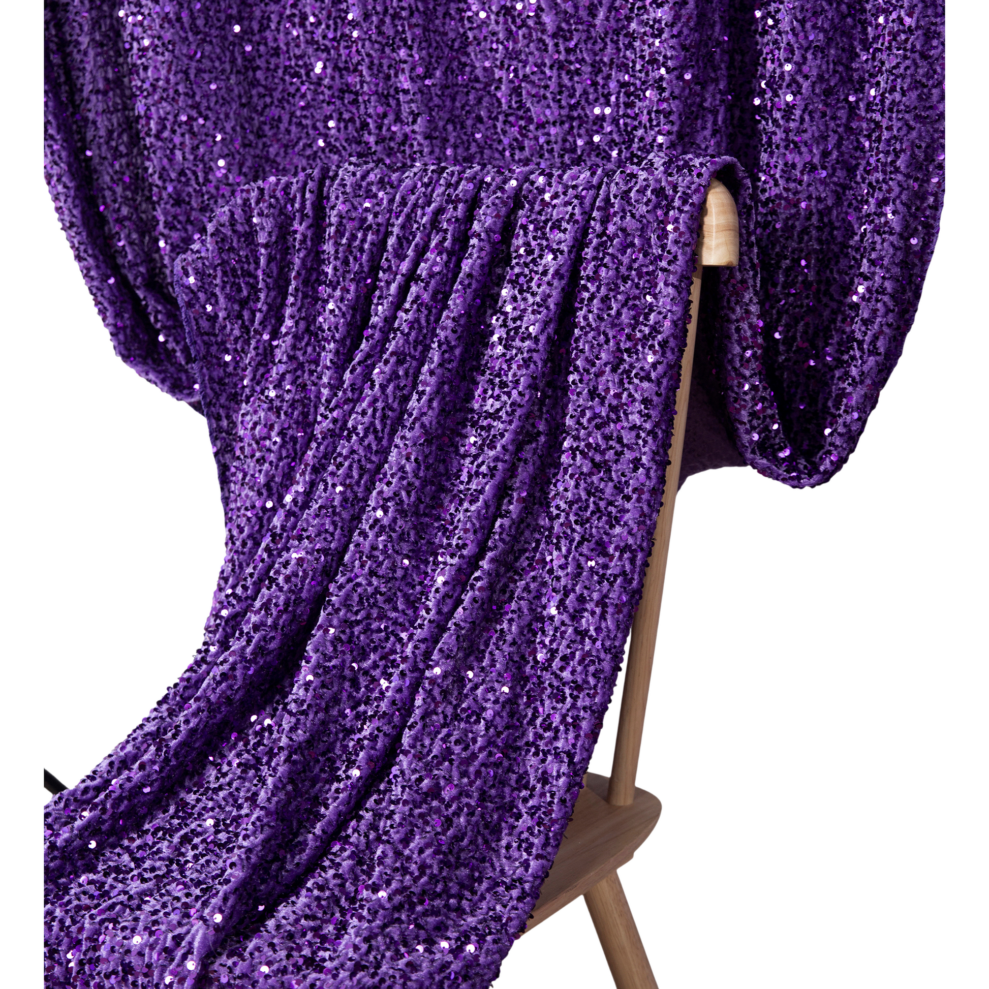 Purple Sequin Velvet 10x52 Backdrop Curtain Panel hanging on a chair