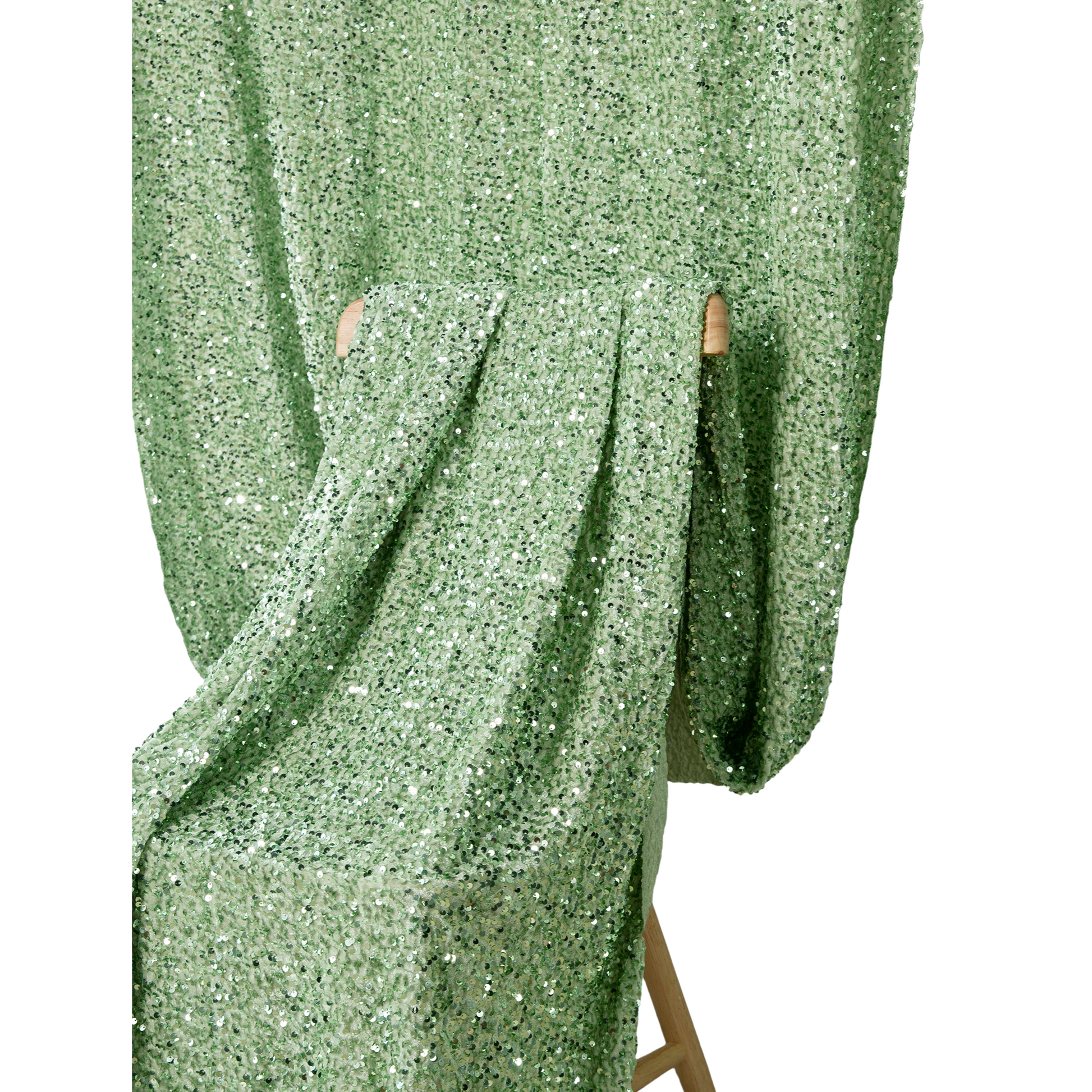 Sage Green Sequin Velvet 10x52 Backdrop Curtain Panel hanging on a chair