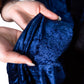 Navy velvet backdrop drape close-up view