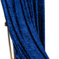 Navy blue velvet drape detail showing luxurious texture over wooden chair