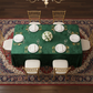 Velvet 90"x132" Rectangular Tablecloth - Emerald Green with Chiavari Chairs in Bird's Eye View.