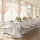 Wedding reception with the White Premium Satin Wrinkle-Resistannt Rectangular Tablecloth, blush sheer drapes and white charger plates