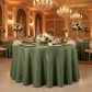 Accordion Crinkle Taffeta 132" Round Tablecloth - Willow Green in Ballroom Reception with Oval Chairs.